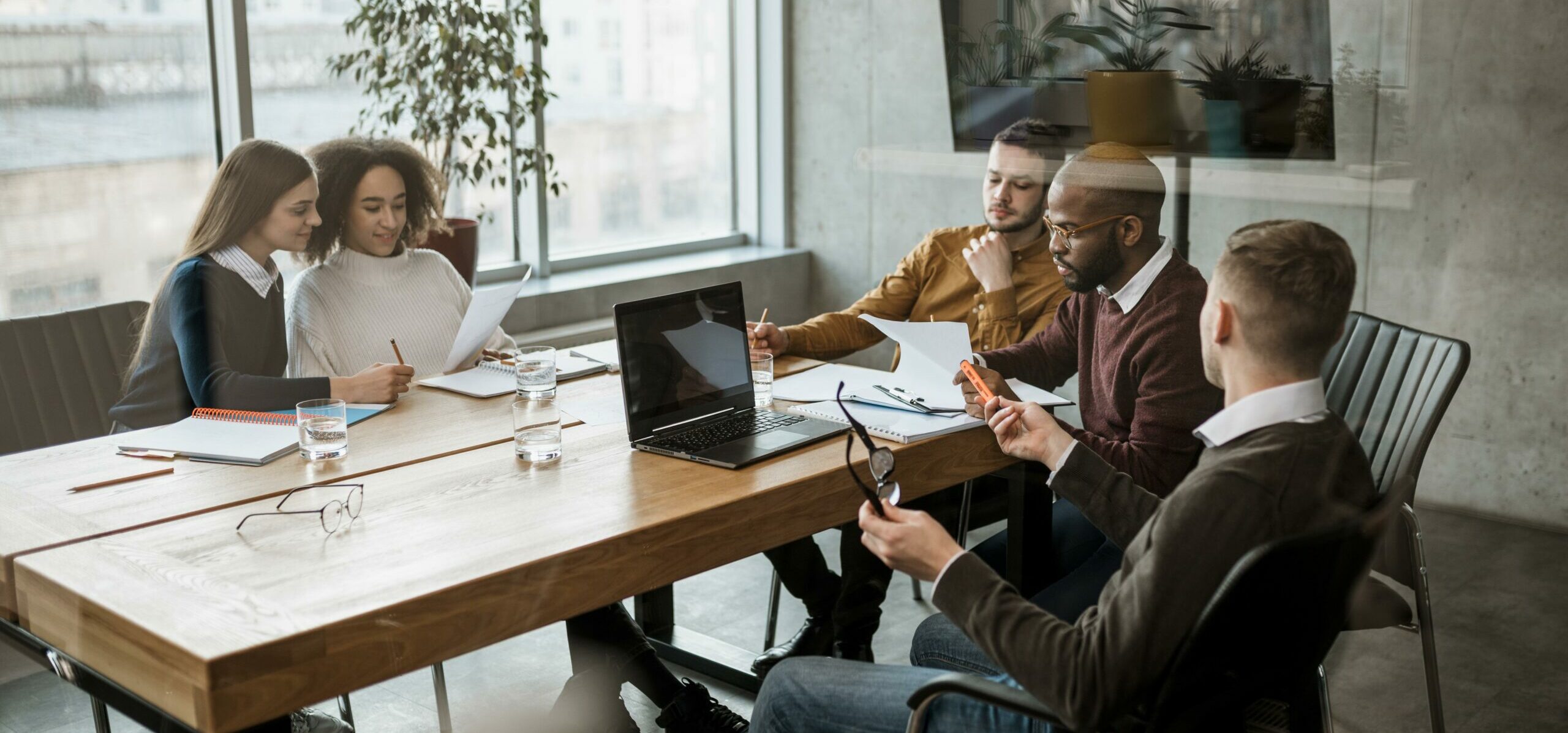 front-view-people-having-meeting-office front-view-people-having-meeting-office
